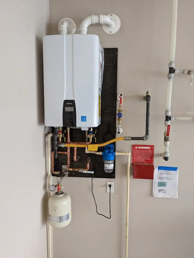 Professional plumber installing copper piping in a Mexico home